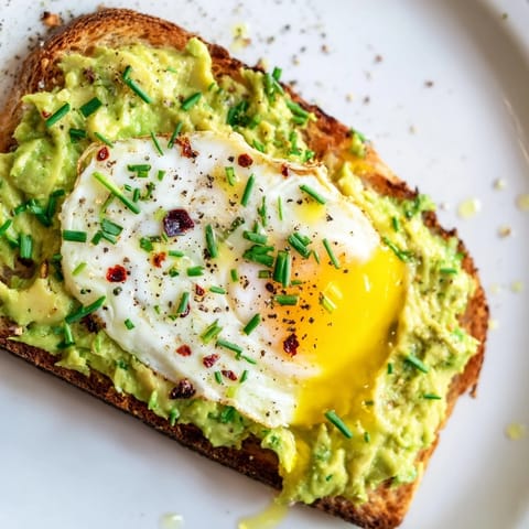 Perfectly cooked egg crowns this easy avocado toast for a satisfying breakfast or snack.